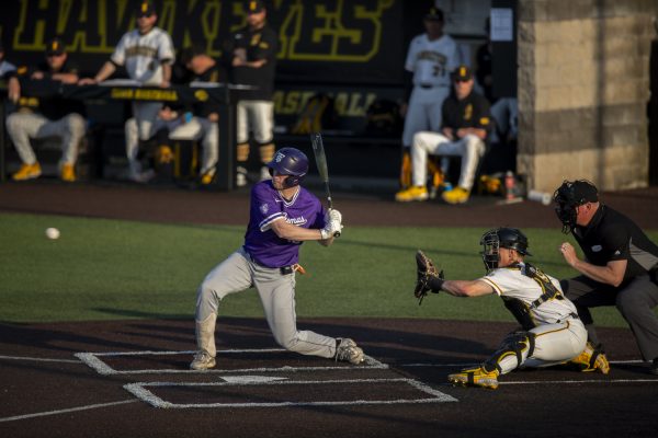 A St. Thomas player prepares to swing during a baseball game between St. Thomas and Iowa at Duane Banks Field in Iowa City, Iowa. The Hawkeyes defeated the Tommies 17-11.