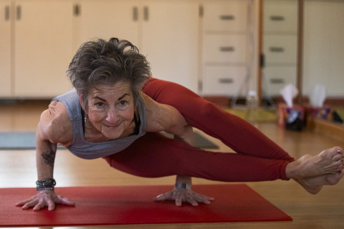 Martha Gordon practices yoga in her studio in Iowa City on Thursday April 11, 2024. Gordon has practiced yoga in Iowa City for over 20 years. (Shaely Odean/The Daily Iowan).