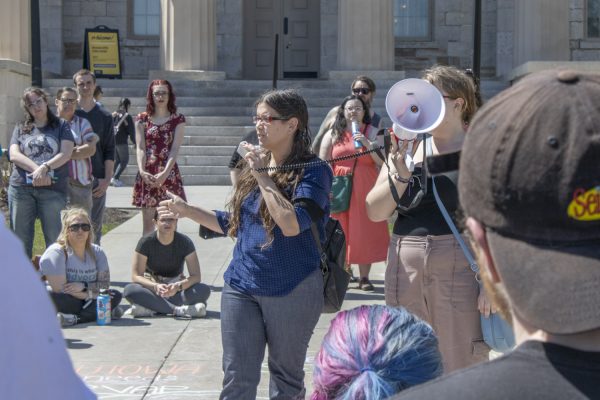 Mandi Remington speaks during a protest on the Pentacrest about the University’s removal of RVAP, the Rape Victim Advocacy Program, on Saturday, April 13, 2024.