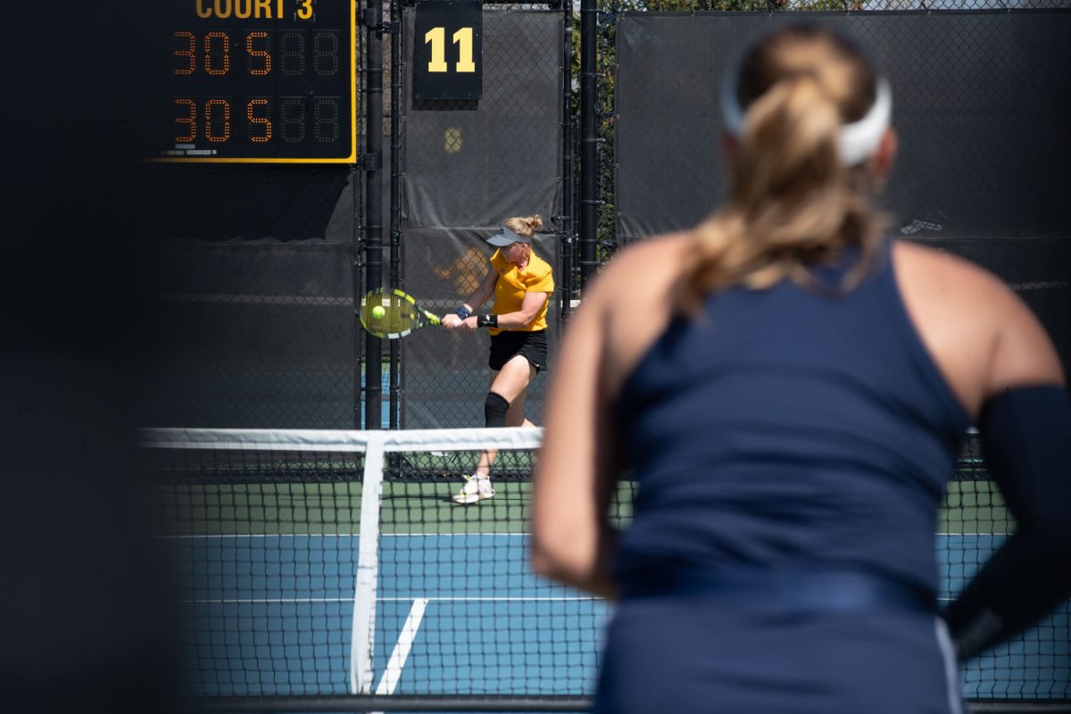 Barbora Pokorna hitting the ball during a tennis meet at the Hawkeye Tennis and Recreational Complex in Iowa City on Sunday, April 14, 2024. The Hawkeyes swept Penn State, 4-0.