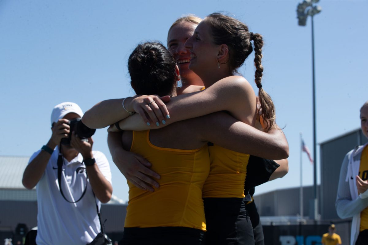 Iowa teammates celebrating after a tennis meet at the Hawkeye Tennis and Recreational Complex in Iowa City on Sunday, April 14, 2024. The Hawkeyes swept Penn State, 4-0.