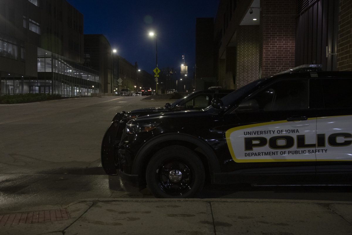 University of Iowa Police cars are seen outside of the Old Capitol Mall in Iowa City on April 16, 2024.