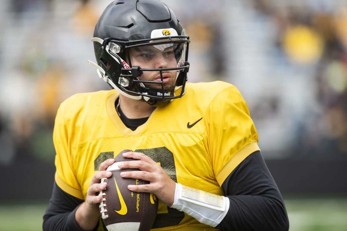 Iowa quarterback Deacon Hill completes a drill during an Iowa football spring practice at Kinnick Stadium in Iowa City on Saturday, April 20, 2024.