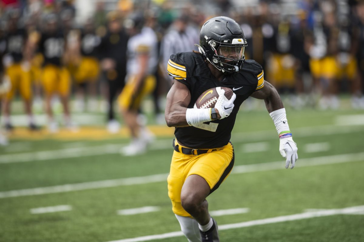 Iowa running back Kaleb Johnson runs the ball during an Iowa football spring practice at Kinnick Stadium in Iowa City on Saturday, April 20, 2024.