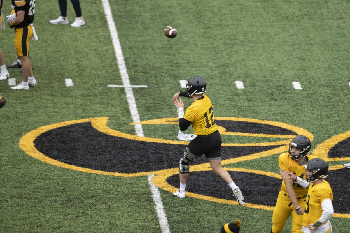 Iowa quarterback Cade McNamara running drills during a spring football practice at the Kinnick Stadium on Saturday, April 20, 2024.