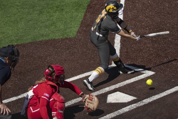 Iowa infielder Tory Bennett swings at the ball during a softball game between Iowa and Indiana at Bob Pearl Field in Iowa City on Sunday, April 21, 2024. The Hoosiers defeated the Hawkeyes 7-3. 