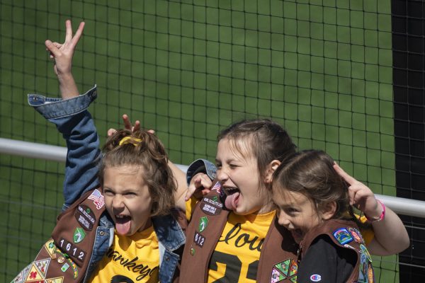 Girl Scouts pose for a photo during a softball game between Iowa and Indiana at Bob Pearl Field in Iowa City on Sunday, April 21, 2024. The Hoosiers defeated the Hawkeyes 7-3.