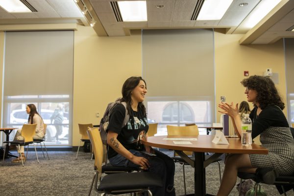 A community member speaks with an asexual “book” during a Human Library event at the Iowa City Public Library on Sunday, April 21, 2024. Community members had the chance to sit down with people with diverse experiences and ask questions.