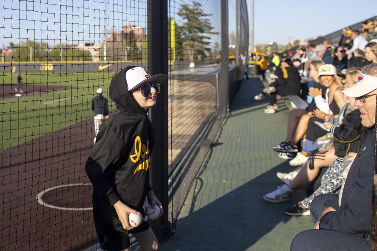 Kid Captain Liam Doxsee celebrates during a baseball game between Iowa and Milwaukee at Duane Banks Field on Tuesday, April 23, 2024. The Hawkeyes defeated the Panthers, 12-6.