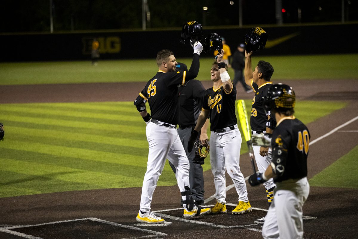 Iowa players celebrate during a baseball game between Iowa and Milwaukee at Duane Banks Field on Tuesday, April 23, 2024. The Hawkeyes defeated the Panthers, 12-6.
