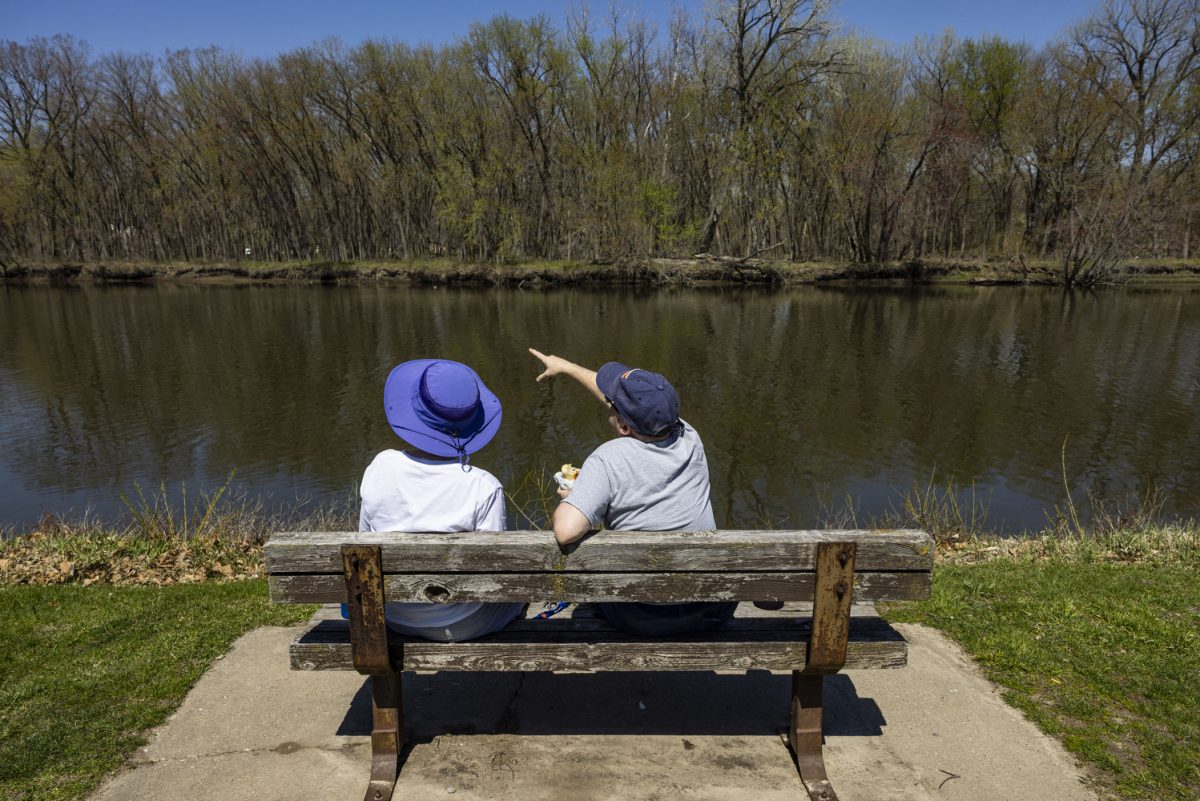 Mary Vermillion (left) and Ben Thiel (right) eat Jimmy Johns and enjoy the views at City Park in Iowa City, Iowa, on Sunday, April 14, 2024. Numerous families, groups, and friends congregated in the park to soak up the sun. Temperatures in Iowa City reached up to 86 degrees.