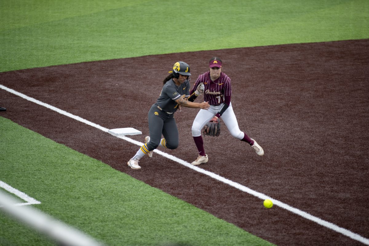 Iowa infielder Avery Jackson and Minnesota infielder Kayla Chavez collide during a softball game between Minnesota and Iowa at Bob Pearl Field in Iowa City, Iowa. The Golden Gophers defeated the Hawkeyes 6-2 in extra innings.