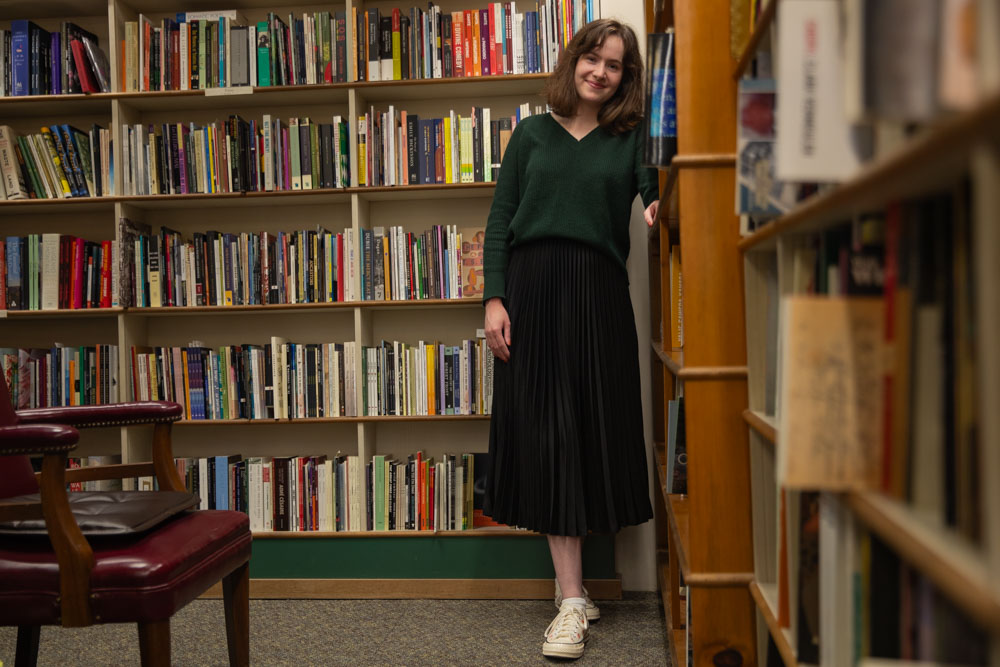 Assistant publisher of Ink Lit Magazine Jenna Mather poses for a portrait at Prairie Lights bookstore in Iowa City on Monday April 29, 2024. (Shaely Odean/The Daily Iowan)