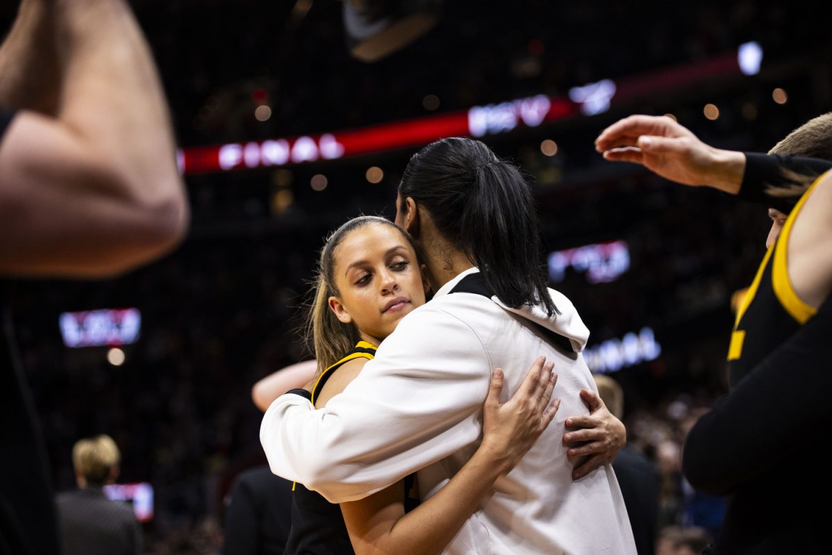 Iowa guard Gabbie Marshall hugs Iowa forward Jada Gyamfi during the NCAA Championship game between No. 1 Iowa and No. 1 South Carolina at Rocket Mortgage FieldHouse in Cleveland, Ohio, on Sunday, April 7, 2024. The Gamecocks defeated the Hawkeyes, 87-75. (Grace Smith/The Daily Iowan)