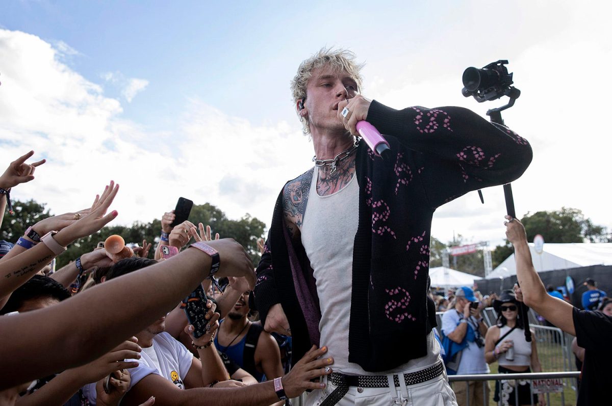 Machine Gun Kelly jumps into the pit at the Austin City Limits Music Festival in Zilker Park on Friday October 1, 2021.
