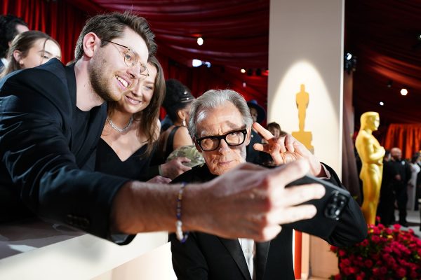 Mar 12, 2023; Los Angeles, CA, USA; Bill Nighy takes selfies with fans as he arrives at the 95th Academy Awards at the Dolby Theatre at Ovation Hollywood in Los Angeles on Sunday, March 12, 2023. Mandatory Credit: Robert Hanashiro-USA TODAY