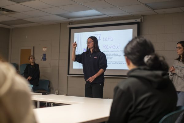 Vice President Ellie McGovern leads midterm review during University of Iowa ASL Club at Phillips Hall in Iowa City on Tuesday, Oct. 17, 2023.