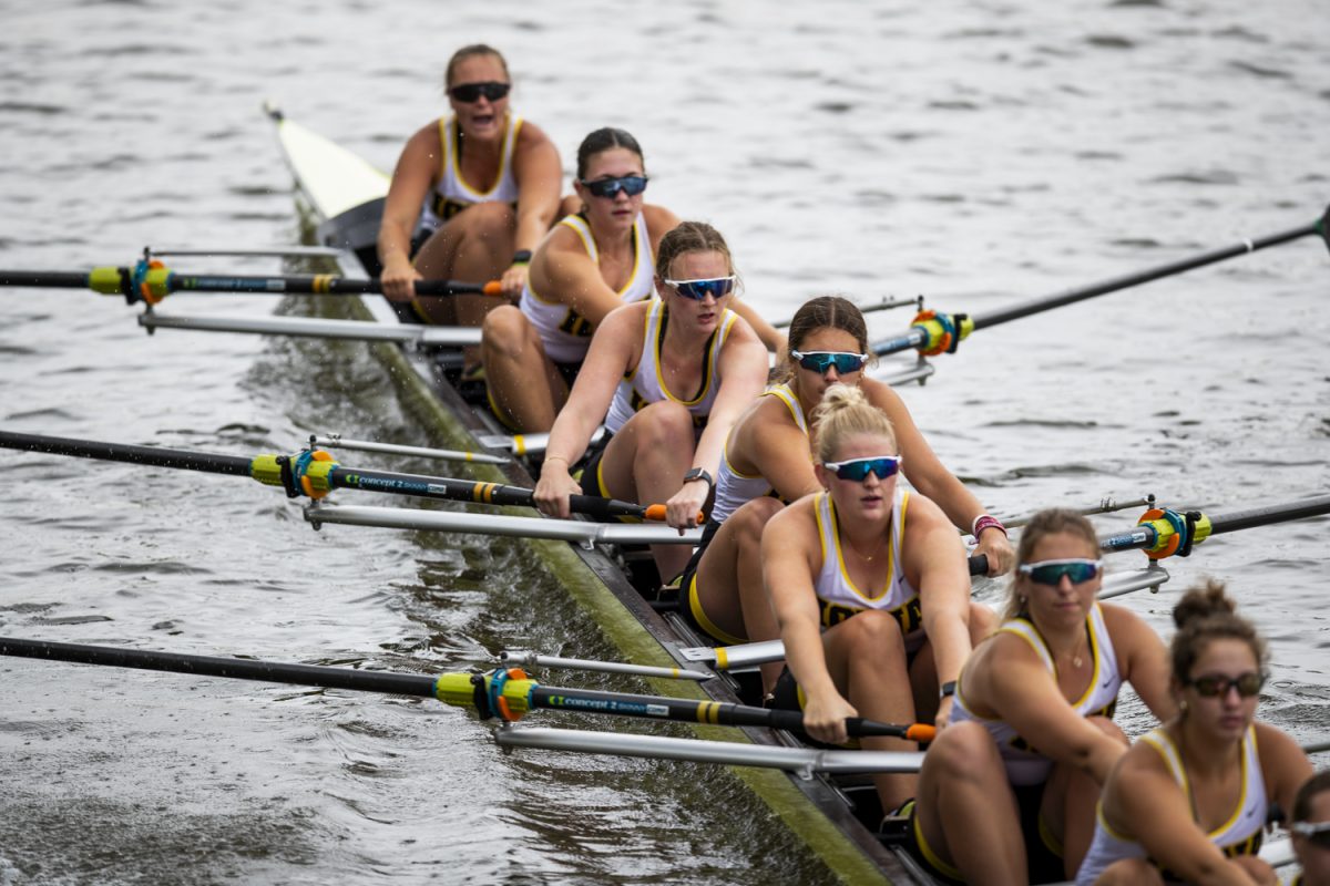 An Iowa eight pulls away from the starting line during the Rowing Exhibition hosted by the Iowa Hawkeyes against the Drake Bulldogs in the Iowa River on Saturday, May 4, 2024. Rain caused officials to cancel the exhibition midway through.