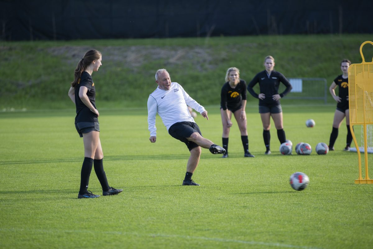 Iowa head coach Dave Dilanni teaches the team a drill during an Iowa Women’s Soccer open practice at the Iowa Soccer Complex on Friday, May 10, 2024. Iowa women’s soccer claimed the Big Ten title last year, the second in program history.