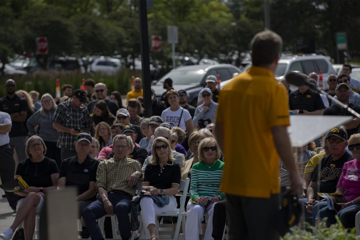Members of the audience watch as Iowa coach Tom Brands speaks during the dedication ceremony for the University of Iowa’s Goschke Family Wrestling Training Center on Thursday, May 30, 2024.