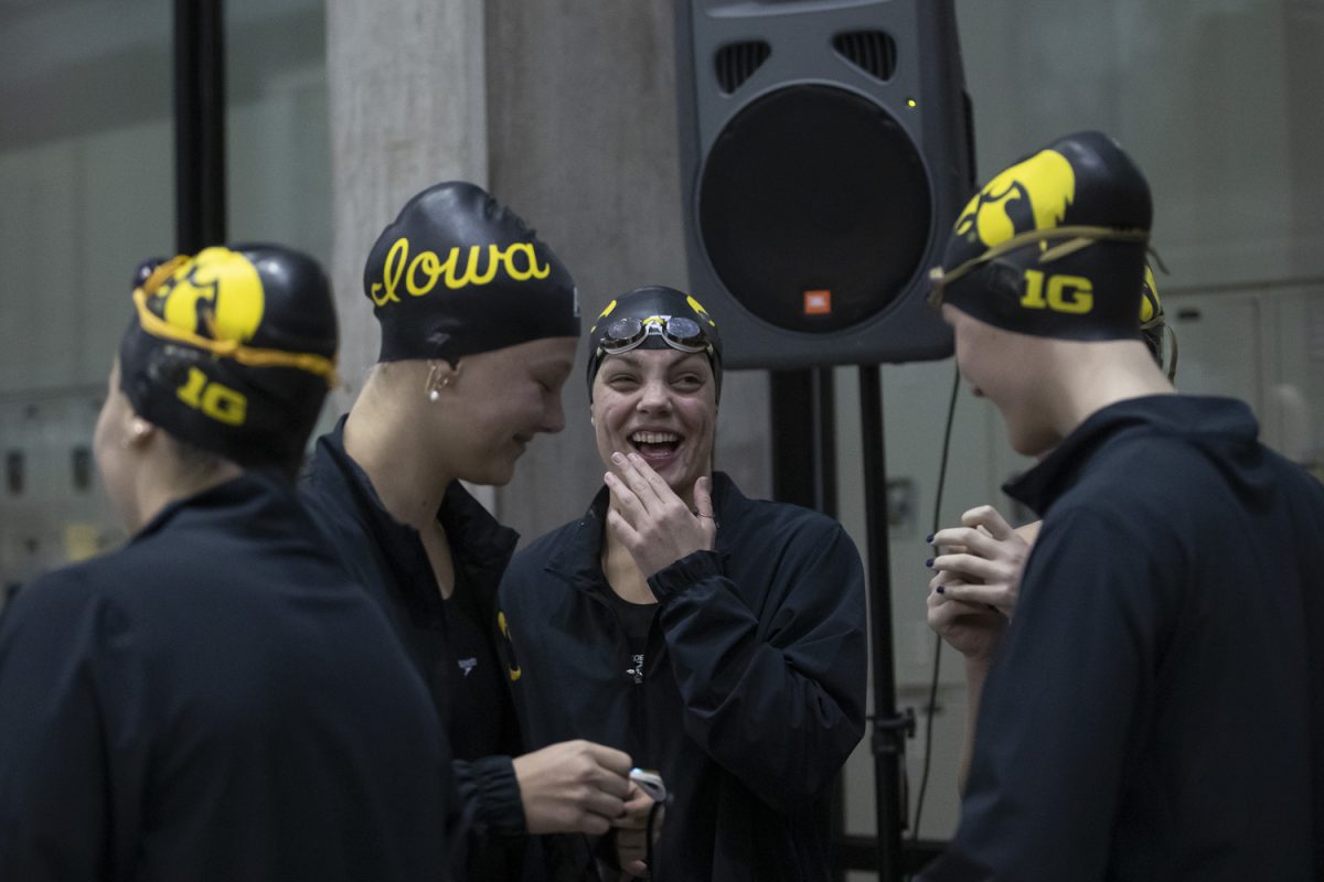 University of Iowa swimmers await the start of the Hawkeye Invitational Meet at the University of Iowa Campus Recreation and Wellness Center on Thursday, Nov. 21, 2024. Iowa competed against Kansas, Nebraska, Northern Iowa, San Diego State, Arkansas, Colorado State, Illinois, and Iowa State. Iowa finished fifth overall with 879 points and three champions.