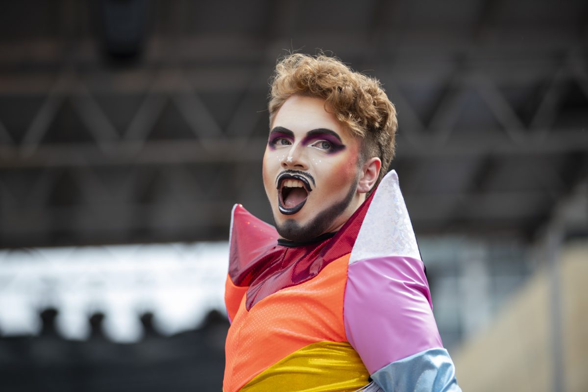 Drag performer Sonny Noble lip-syncs during the 53rd annual pride parade and festival in downtown Iowa City on Saturday, June 15, 2024. The event included a parade, performances, and local vendor stations around downtown. (Shaely Odean/ The Daily Iowan)