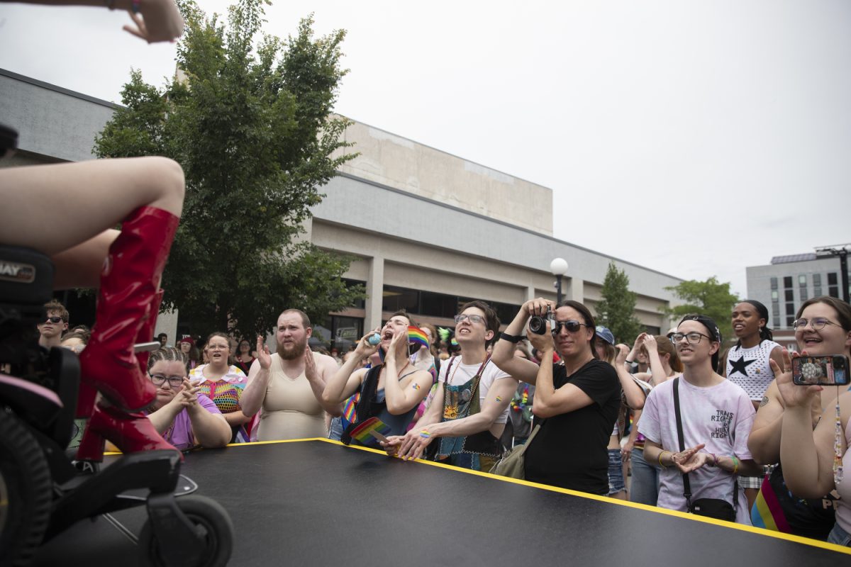 The crowd reacts to a dance by Aria Buntinas during the 53rd annual pride festival in downtown Iowa City on Saturday, June 15, 2024. The event included a parade, performances, and local vendor stations around downtown.