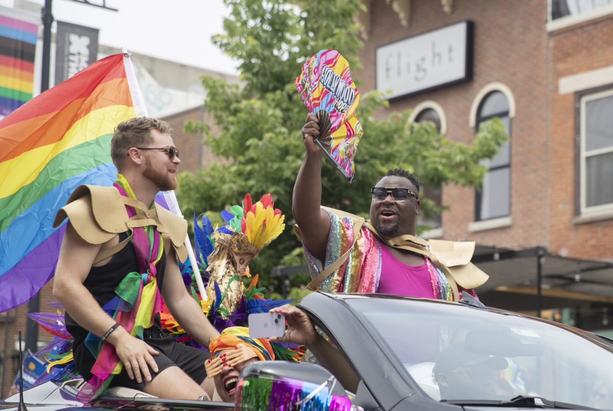 Iowa City Mayor Bruce Teague waves to the crowd during the 53rd annual pride parade in downtown Iowa City on Saturday, June 15, 2024. The event included a parade, performances, and local vendor stations around downtown.