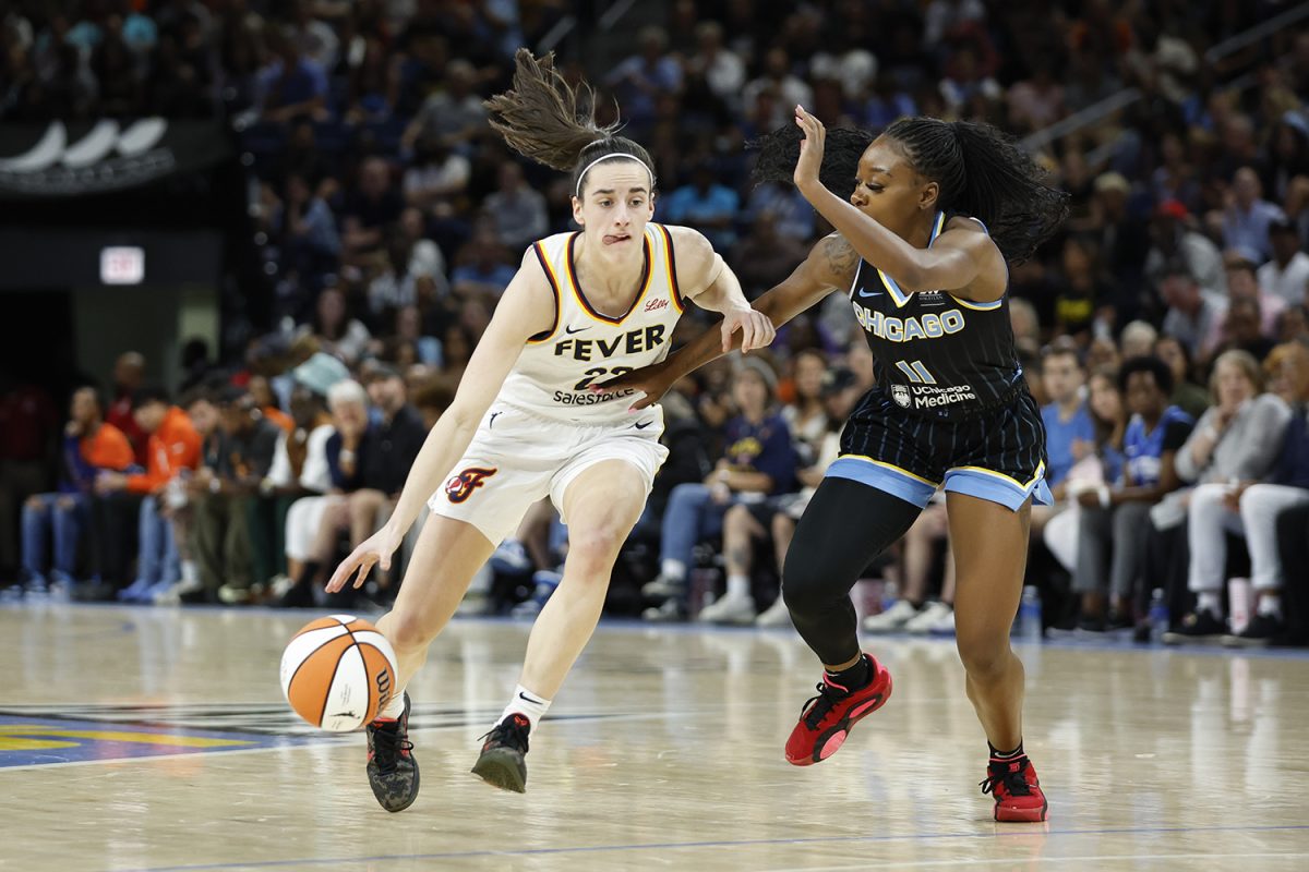 Jun+23%2C+2024%3B+Chicago%2C+Illinois%2C+USA%3B+Indiana+Fever+guard+Caitlin+Clark+%2822%29+drives+to+the+basket+against+Chicago+Sky+guard+Dana+Evans+%2811%29+during+the+first+half+of+a+basketball+game+at+Wintrust+Arena.+Mandatory+Credit%3A+Kamil+Krzaczynski-USA+TODAY+Sports