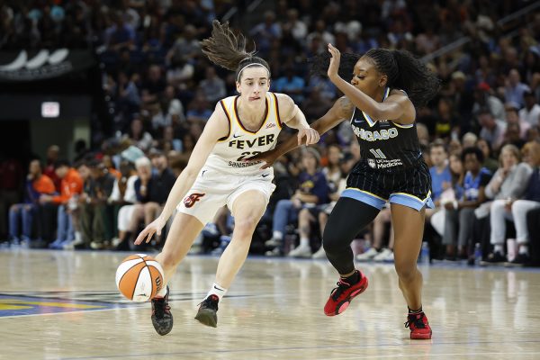 Jun 23, 2024; Chicago, Illinois, USA; Indiana Fever guard Caitlin Clark (22) drives to the basket against Chicago Sky guard Dana Evans (11) during the first half of a basketball game at Wintrust Arena. Mandatory Credit: Kamil Krzaczynski-USA TODAY Sports