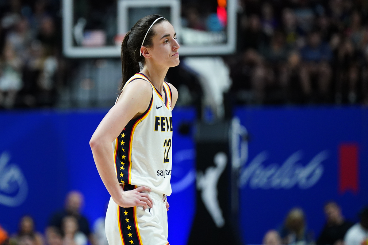 Jun 10, 2024; Uncasville, Connecticut, USA; Indiana Fever guard Caitlin Clark (22) reacts after her third foul against the Connecticut Sun in the second quarter at Mohegan Sun Arena. 
