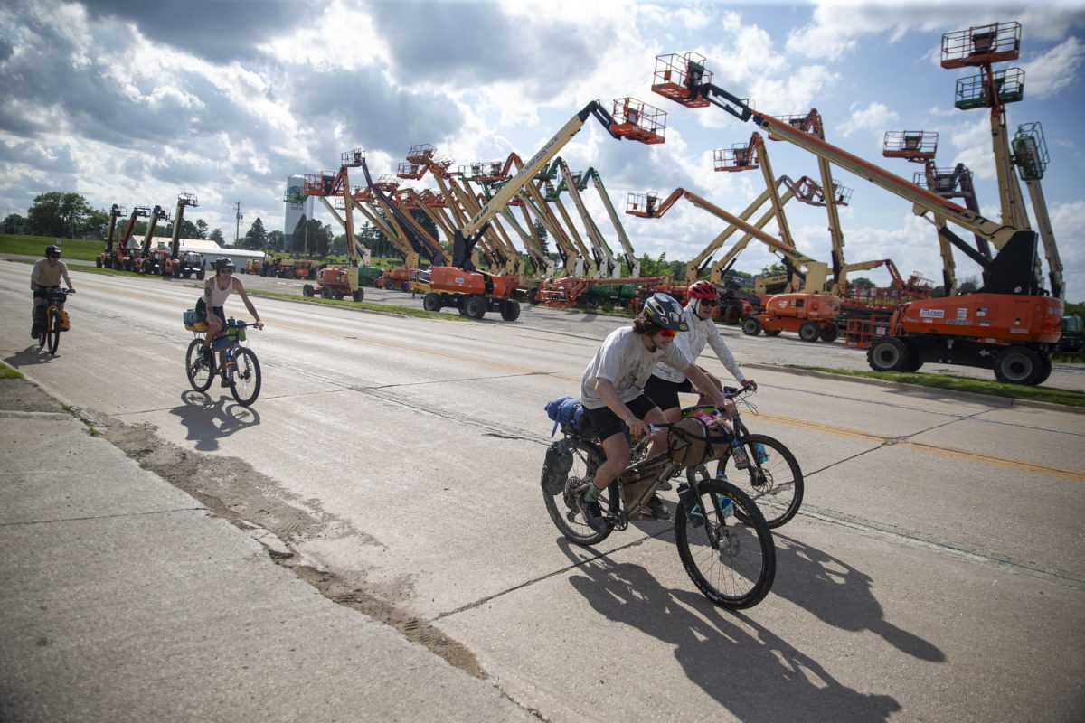 Elijah Mickey, Ben Eastman, Ryan Braverman, and Sayre Satterwhite ride through Guthrie Center, Iowa on Highway 44 on Sunday, June 2, 2024. On day two of the Design, Build and Ride Iowa bicycle tour, participants covered 93 miles with over 2,600 vertical feet of climbing.