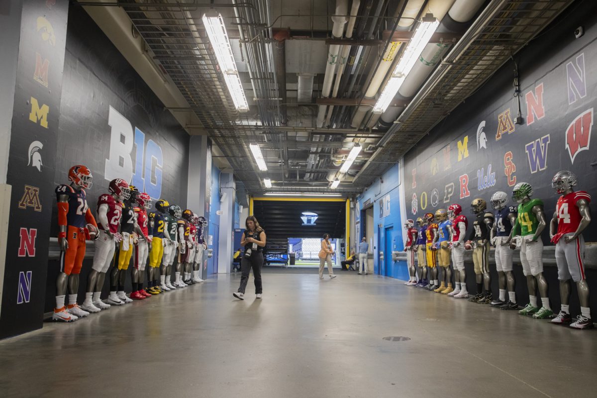 Jerseys from all 18 Big Ten schools are displayed in the hallway during day one of Big Ten Football Media Day's at Lucas Oil Stadium in Indianapolis, Ind., on July 23. The expansion in the Big Ten, adding four West Coast schools, started in June of 2022, when admittance was granted to USC and UCLA.