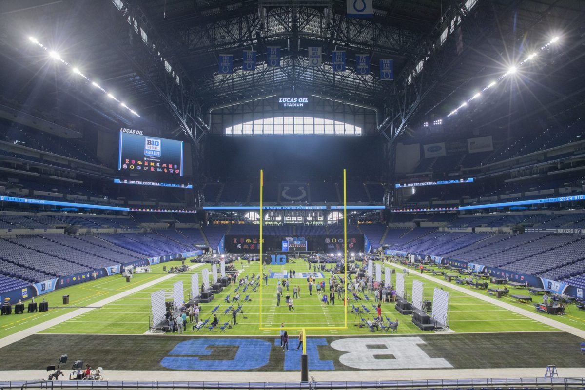 Media members and podium speakers interact during day two of Big Ten Football Media Day at Lucas Oil Stadium in Indianapolis, Ind., on Wednesday, July 24, 2024. Coaches and athletes from Iowa, UCLA, USC, Michigan State, Nebraska, and Penn State answered questions from the media.