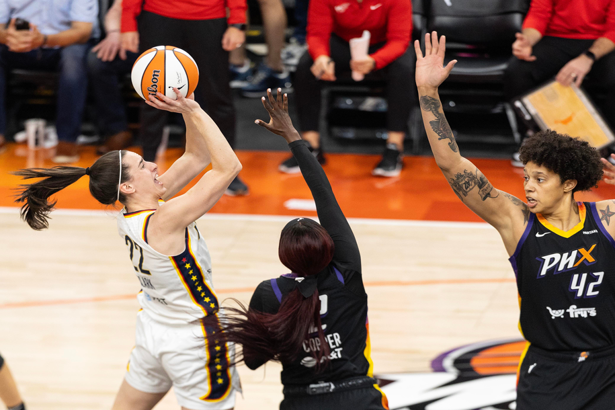 Indiana+Fever+guard+Caitlin+Clark+%2822%29+goes+up+for+a+shot+over+Phoenix+Mercury+guard+Kahleah+Copper+%282%29+on+June+30%2C+2024%2C+at+Footprint+Center+in+Phoenix.
