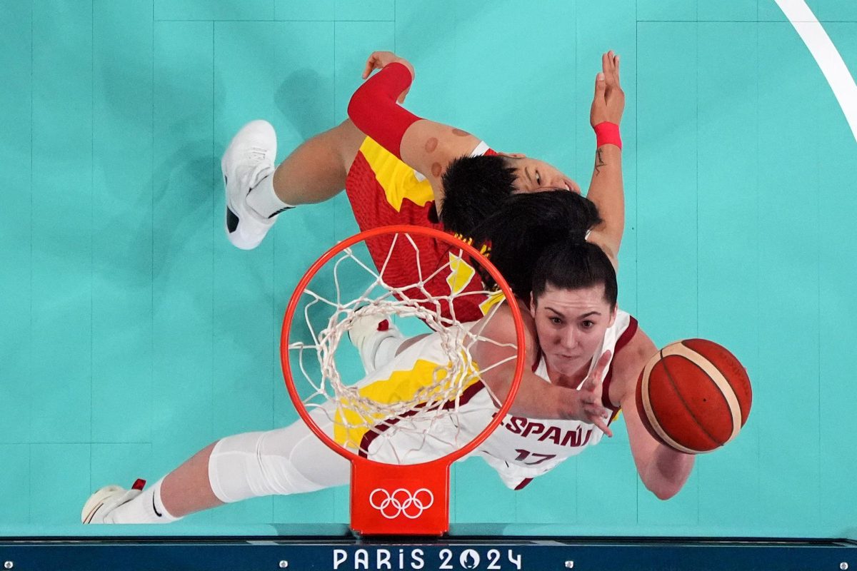 Spain centre Megan Gustafson (17) shoots the ball against Peoples Republic of China power forward Sijing Huang (11) in women’s basketball group A play during the Paris 2024 Olympic Summer Games at Stade Pierre-Mauroy.