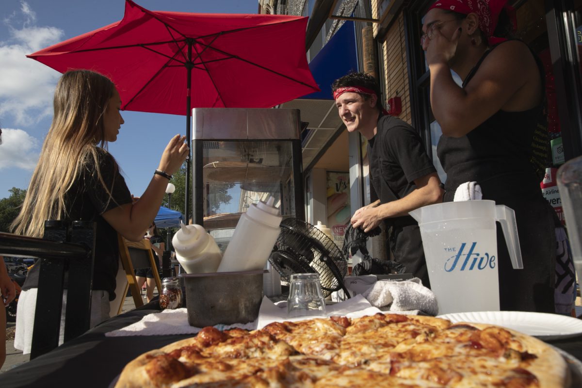 An Airliner employee takes a customer's order during the 16th Annual Taste of Iowa City downtown on Wednesday, Aug. 28, 2024.