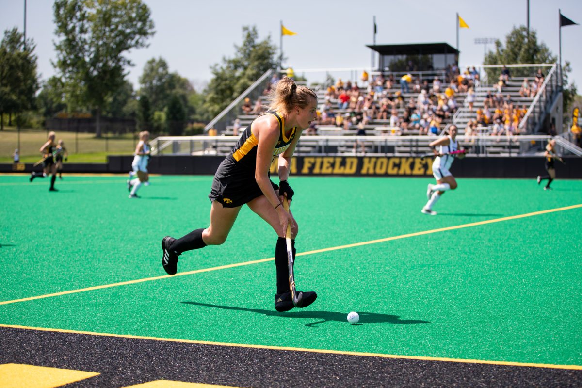 Iowa midfielder Sofie Stribos drives up the field during a field hockey exhibition match between Iowa and Northwestern at Grant Field in Iowa City on Saturday, Aug. 19, 2023. The Hawkeyes will face Miami University at Grant Field on Friday, Sept. 6, 2024. 