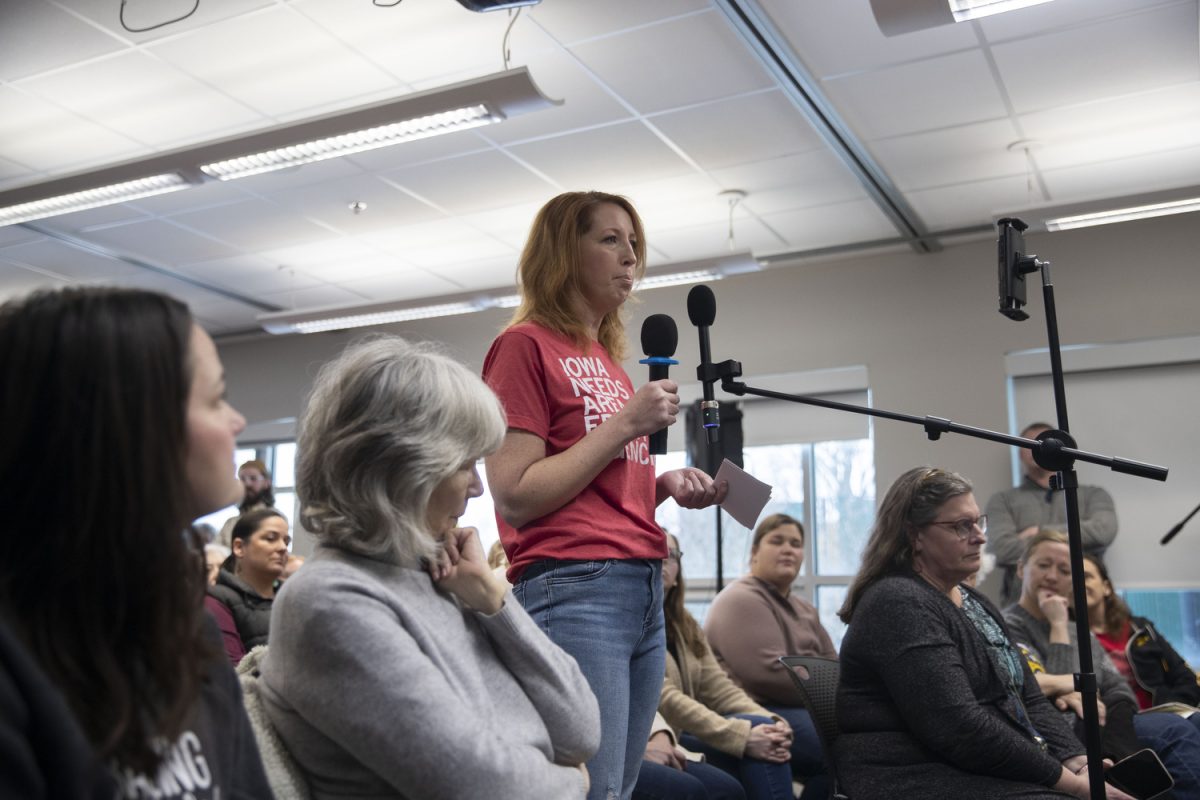 An attendee wearing an “Iowa Needs Area Education Agencies” shirt while speaking about experiences during a conversation with local legislators about Area Education Agencies at the North Liberty public library on Sunday, Jan. 28, 2024. As of August 2024, Iowa AEAs have lost 429 staff members. 