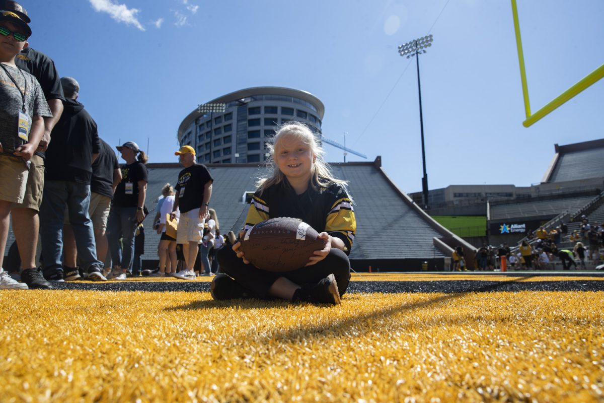 Kid captain Nataleigh Mochal poses for a portrait during Kid’s Day at Kinnick Stadium on Saturday, Aug. 10, 2024. Iowa football players signed autographs for young fans and held an open practice on the Kinnick field.