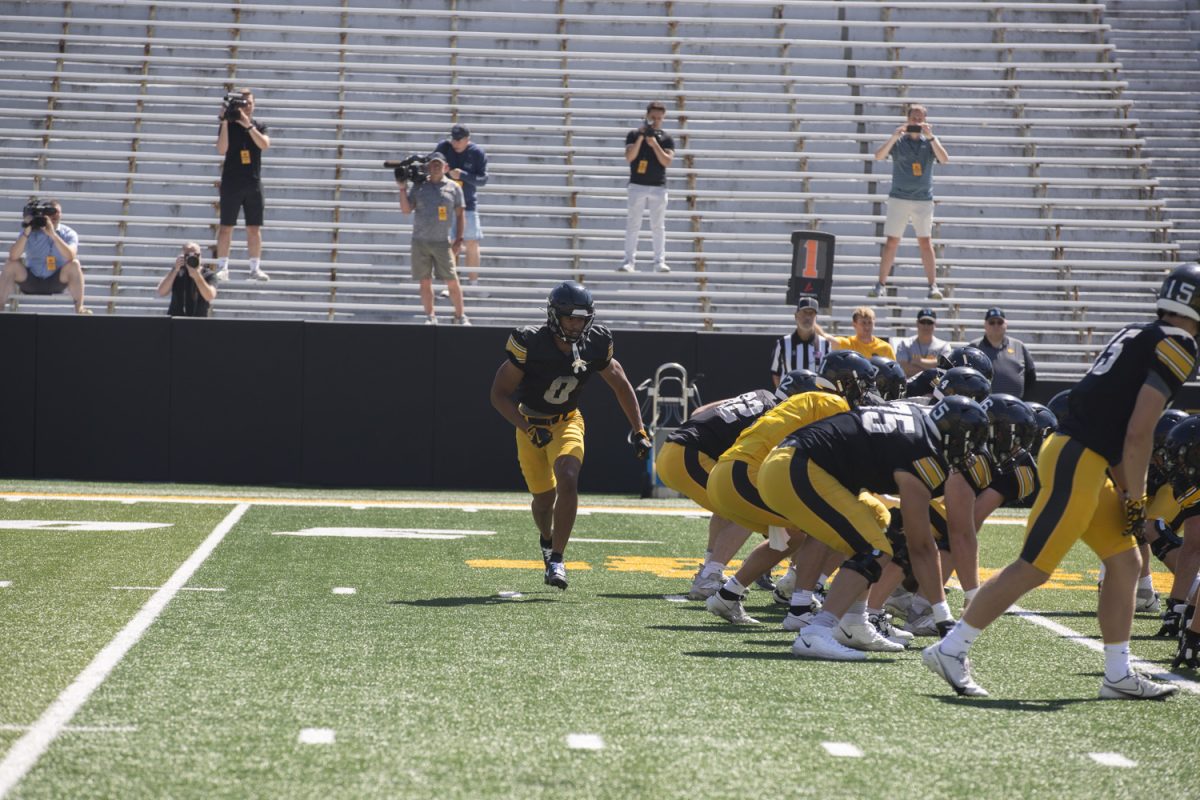 Iowa wide receiver Jarriette Blue runs to the ball during open practice during Kid’s Day at Kinnick Stadium on Saturday, Aug. 10, 2024. Iowa football players signed autographs for young fans and held an open practice on the Kinnick field.