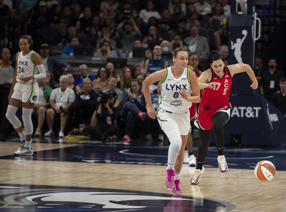 Las Vegas center Megan Gustafson and Minnesota forward Alanna Smith run for a loose ball during a WNBA game between the Minnesota Lynx and the Las Vegas Aces at the Target Center in Minneapolis, Minn. on Friday, Aug. 23, 2024. The Lynx defeated the Aces, 87-74. The teams faced off a two days prior in Las Vegas, where the Lynx won, 98-87.