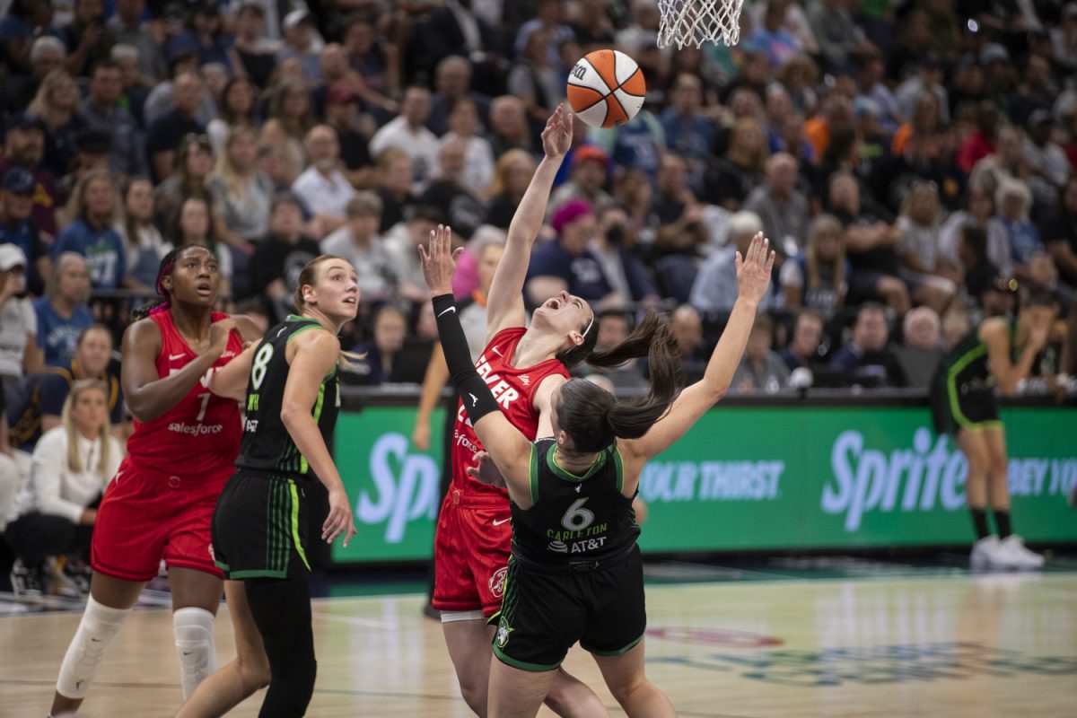 Indiana guard Caitlin Clark shoots the ball over Minnesota forward Bridget Carleton during a WNBA game between the Minnesota Lynx and the Indiana Fever at the Target Center in Minneapolis, Minn., on Saturday, Aug. 24, 2024. The Lynx defeated the Fever, 90-80.