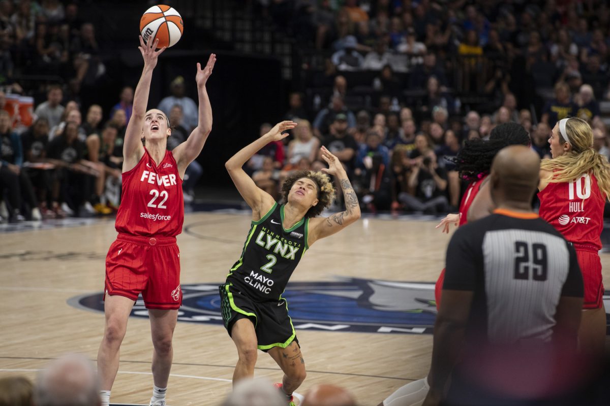 Indiana guard Caitlin Clark grabs a rebound during a WNBA game between the Minnesota Lynx and the Indiana Fever at the Target Center in Minneapolis, Minn., on Saturday, Aug. 24, 2024. The Lynx defeated the Fever, 90-80.