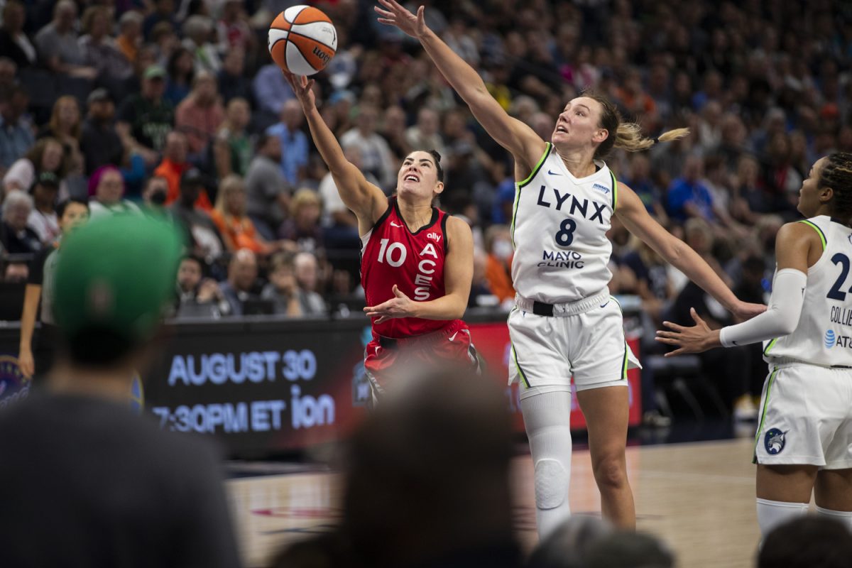 Minnesota forward Alanna Smith attempts to block a shot by Las Vegas guard Kelsey Plum during a WNBA game between the Minnesota Lynx and the Las Vegas Aces at the Target Center in Minneapolis, Minn. on Friday, Aug. 23, 2024. The Lynx defeated the Aces, 87-74. The teams faced off a two days prior in Las Vegas, where the Lynx won, 98-87.