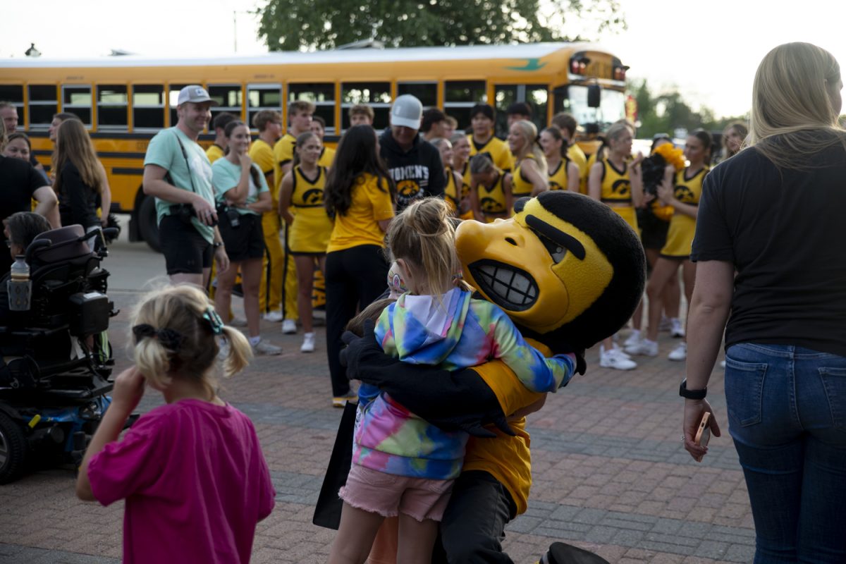 Herky poses for portraits with fans during FryFest in Coralvile on Friday, Aug. 30, 2024. This year marked the 15th anniversary for FryFest and drew crowds of 18,000 people.