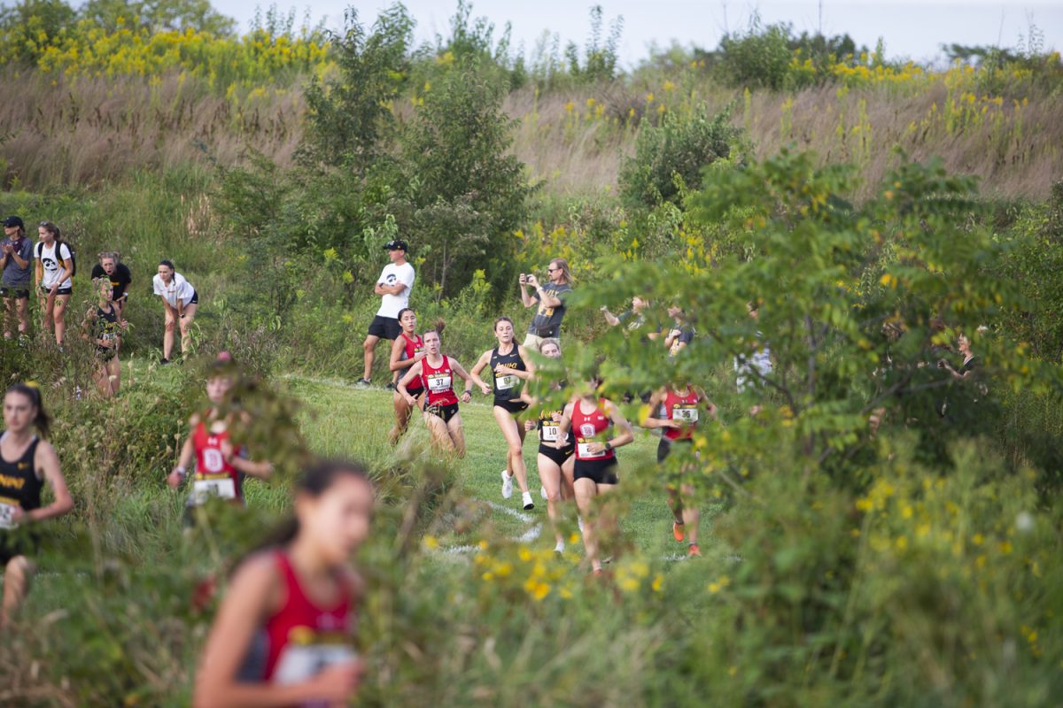 Women’s team runners from Iowa and Bradley University race during the Hawkeye Invite at Ashton Cross Country Course in Iowa City on Friday, Aug. 30, 2024. The Iowa women’s team took second place with 39 points and the Iowa men’s team arrived in third with 75 points.