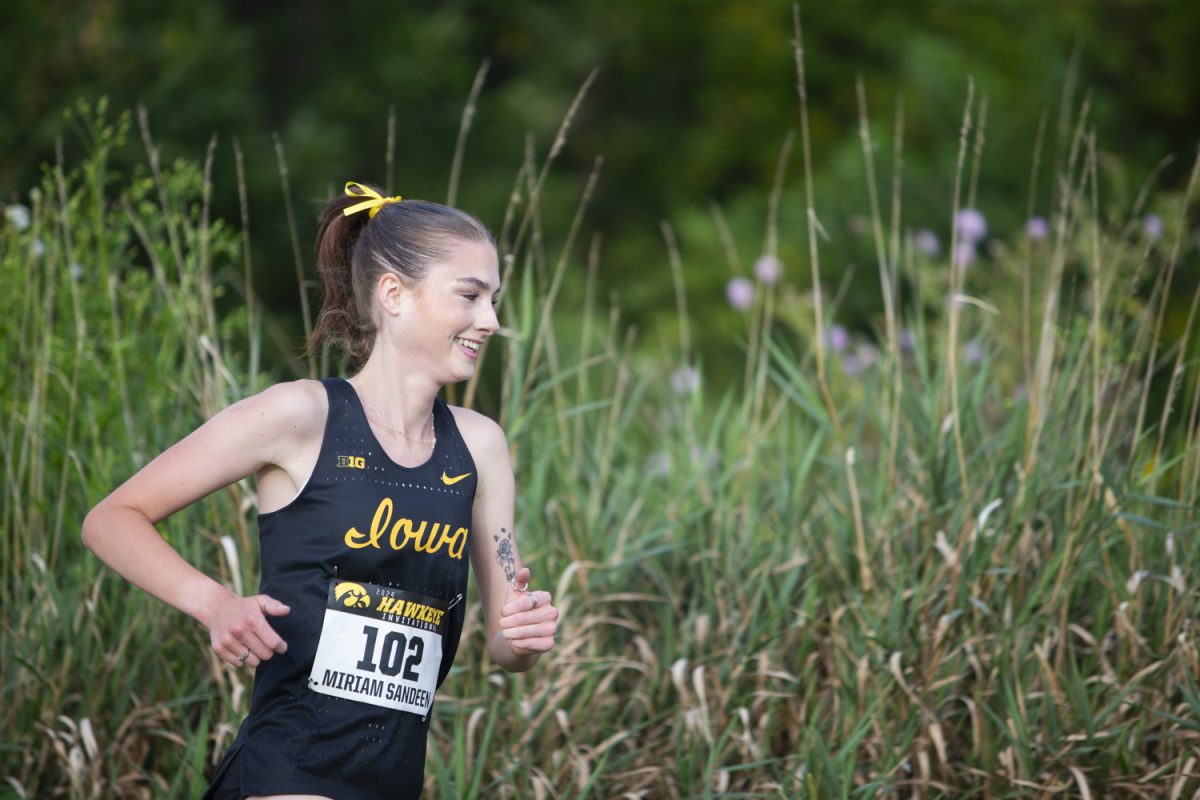 University of Iowa runner Miriam Sandeen runs the 4K race during the Hawkeye Invite at Ashton Cross Country Course in Iowa City on Aug. 30. Sandeen achieved a new personal best with a time of 14:20.4 and came in fourth overall for the women’s team.