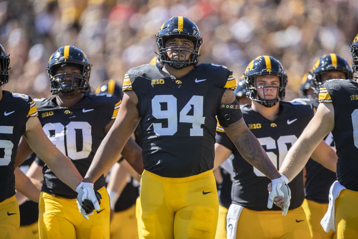 Iowa defensive lineman Yahya Woody walks out with members of the Iowa football team before a football game between Iowa and Illinois State at Kinnick Stadium in Iowa City on Saturday, Aug. 31, 2024. The Hawkeyes defeated the Redbirds 40-0.