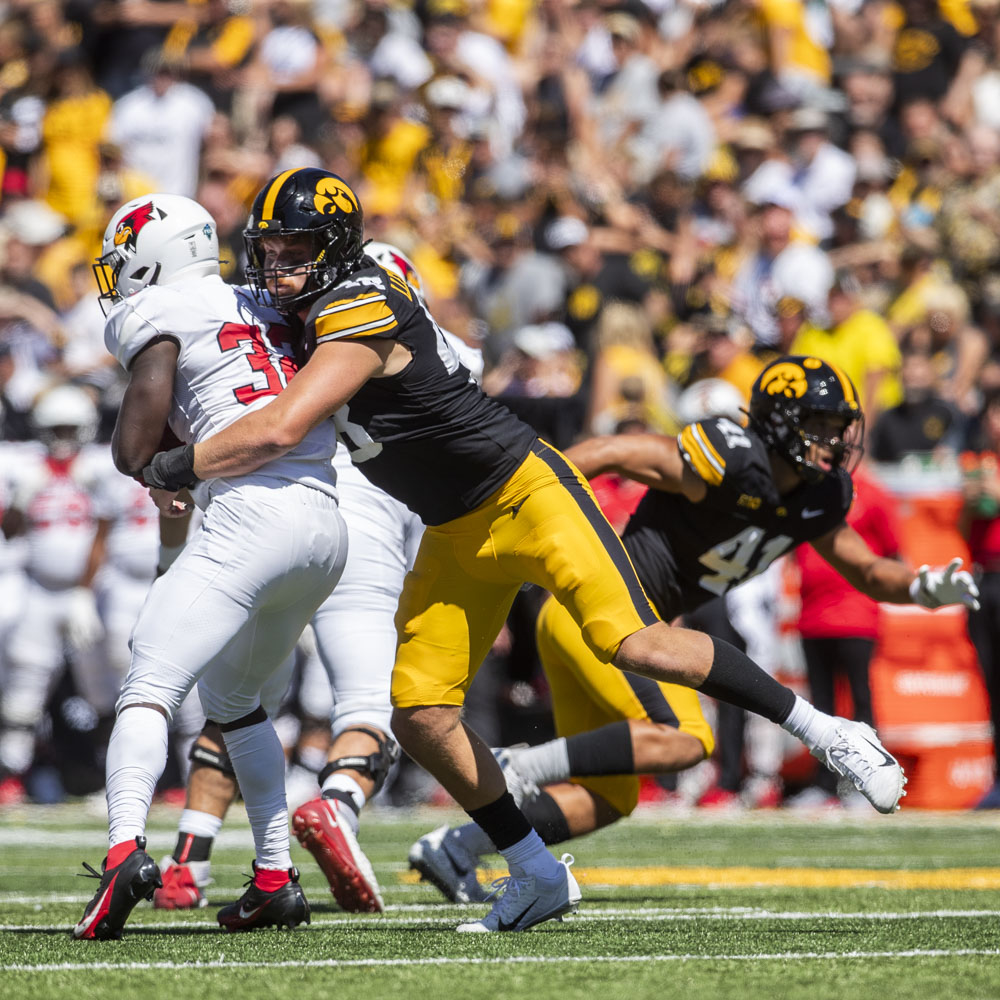 Iowa defensive lineman Max Llewellyn tackles Illinois State running back Wenkers Wright during a football game between Iowa and Illinois State at Kinnick Stadium in Iowa City on Saturday, Aug. 31, 2024. The Hawkeyes defeated the Redbirds 40-0.